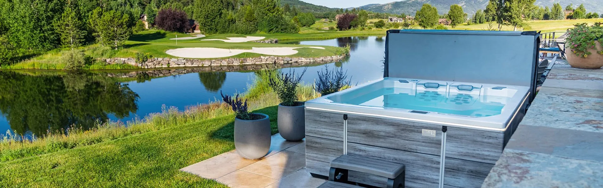 Bullfrog Spas M9 hot tub by the lake