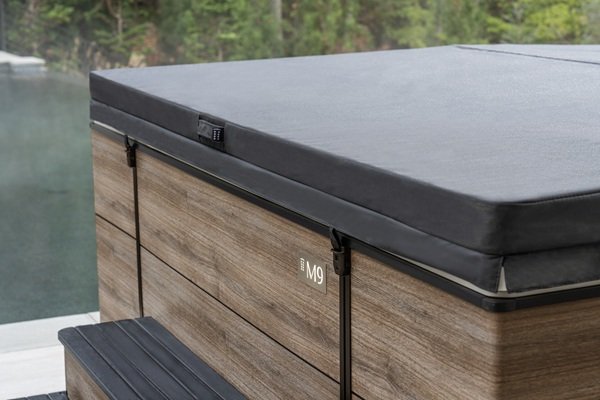 A hot tub cover fit tightly on top of tub.