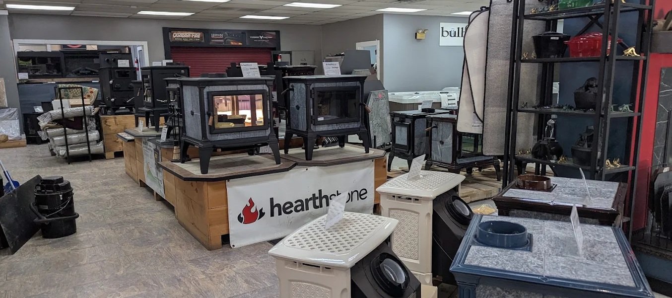 Abundant Life Stoves & Spas showroom floor in Chichester showing all their fireplace and stove inventory.