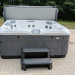 Serene Hot Tub Installation Surrounded by Nature