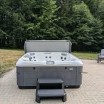 Serene Hot Tub Installation Surrounded by Nature 1