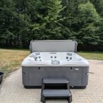 Serene Hot Tub Installation Surrounded by Nature 2