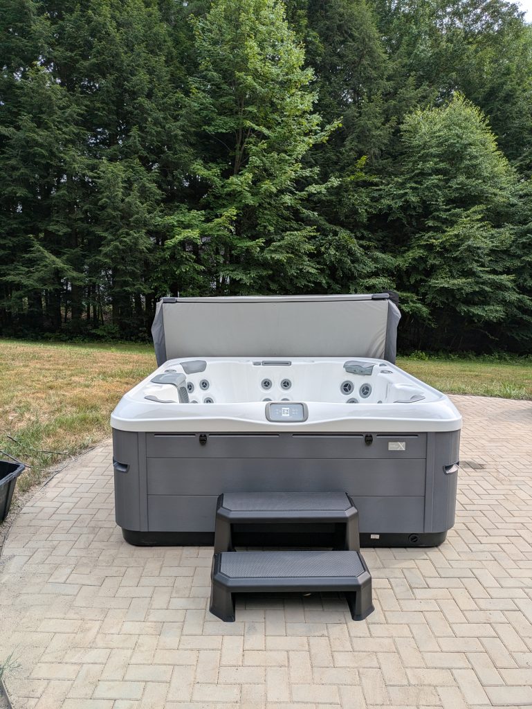 Serene Hot Tub Installation Surrounded by Nature 2