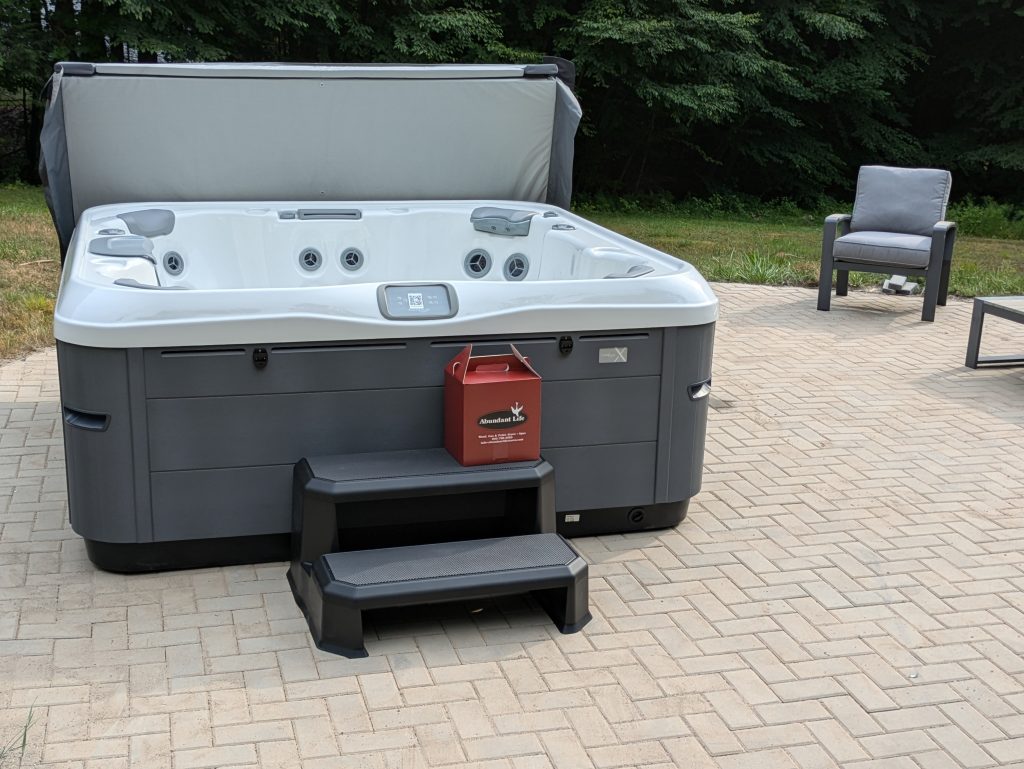 Serene Hot Tub Installation Surrounded by Nature 3