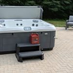 Serene Hot Tub Installation Surrounded by Nature 3