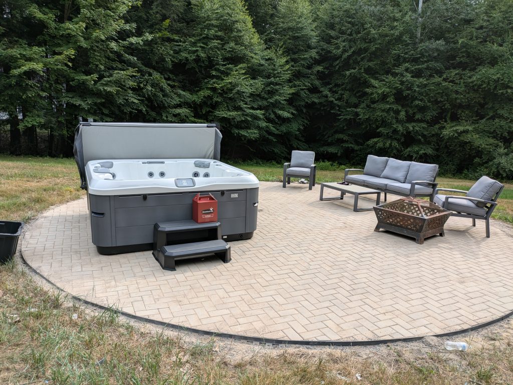 Serene Hot Tub Installation Surrounded by Nature 4
