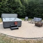 Serene Hot Tub Installation Surrounded by Nature 4