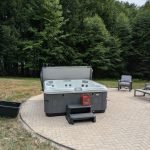 Serene Hot Tub Installation Surrounded by Nature 5
